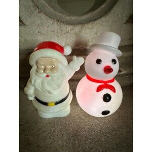 Vintage battery operated small blow molds Santa Claus and snowman.